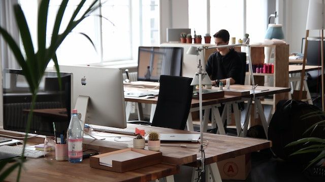 Image of office with computer on desk.