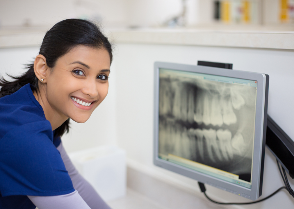 Dentist viewing radiograph