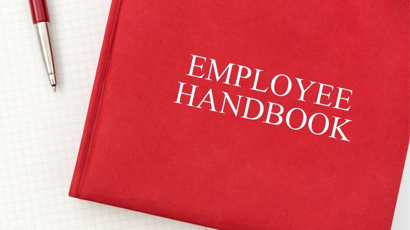 Bound book with the title "Employee Handbook". Dental Practice Law